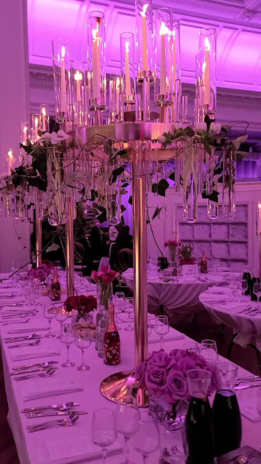 Candelabra centerpiece under pink light