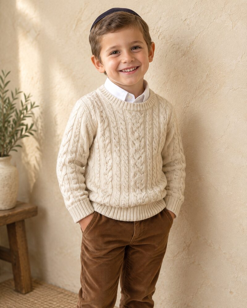 Boy in cream cable-knit sweater