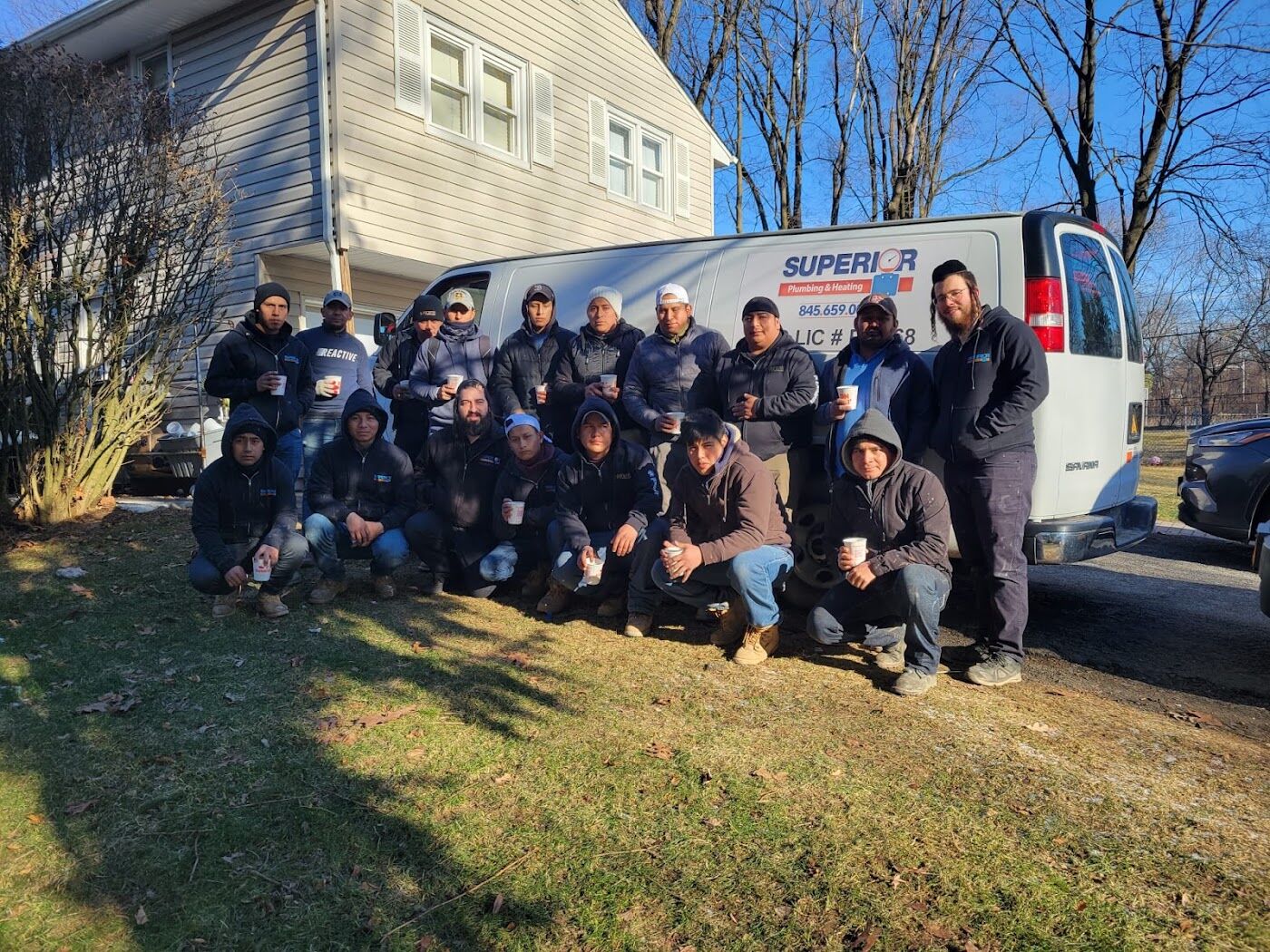 The Superior crew in front of a company van