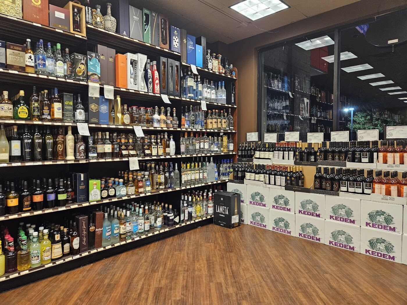 Aisles of wine and spirits with Kedem cases stacked